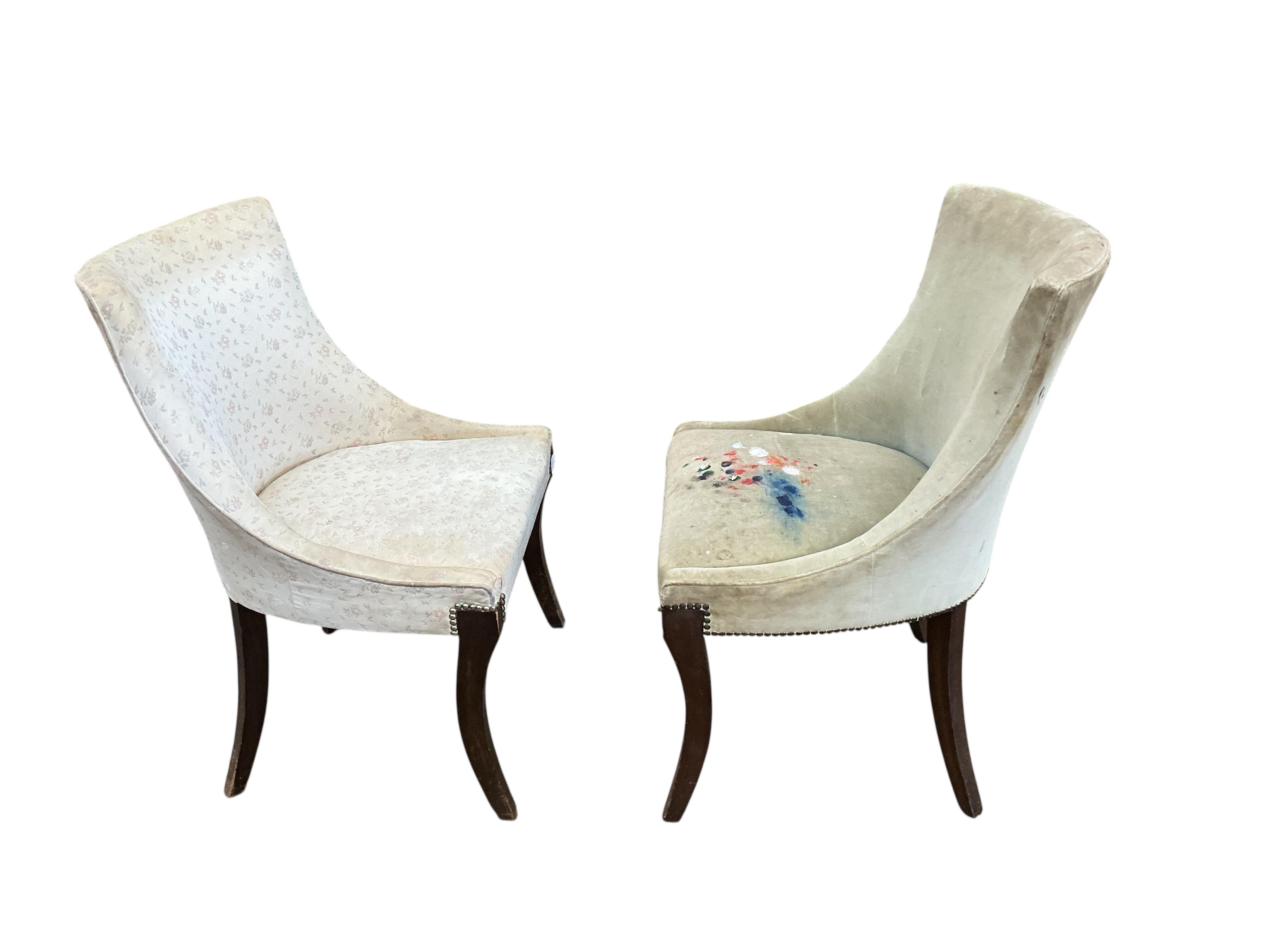 A set of ten Regency style beech framed dining chairs, with upholstered seats and backs, on front sabre legs